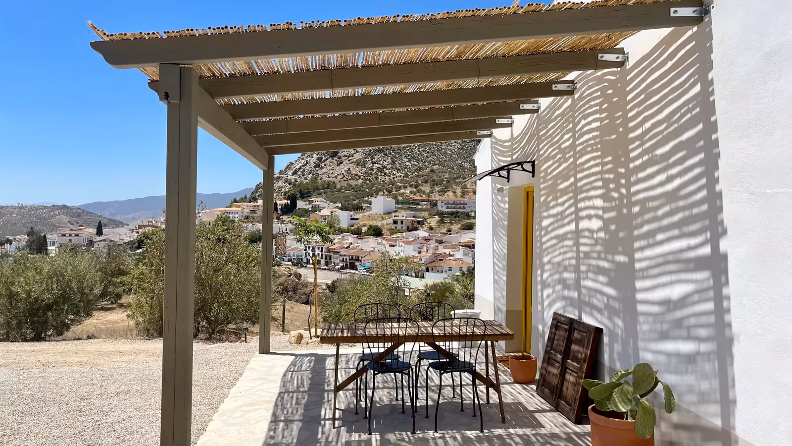 Terrace with pergola and village view